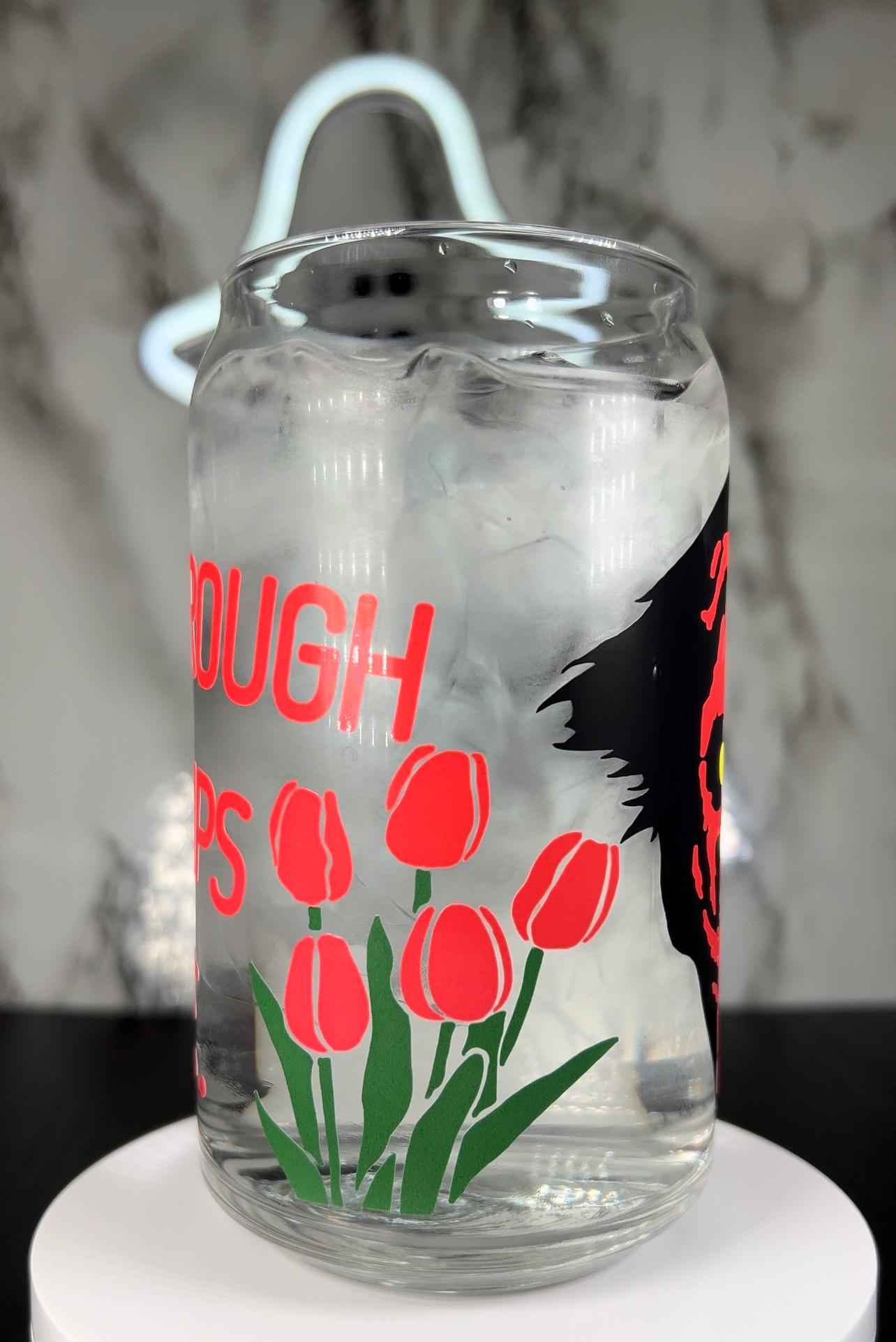 insidious Demon Tiptoe through the tulips with me color changing permanent vinyl on a libbey beer can glass.